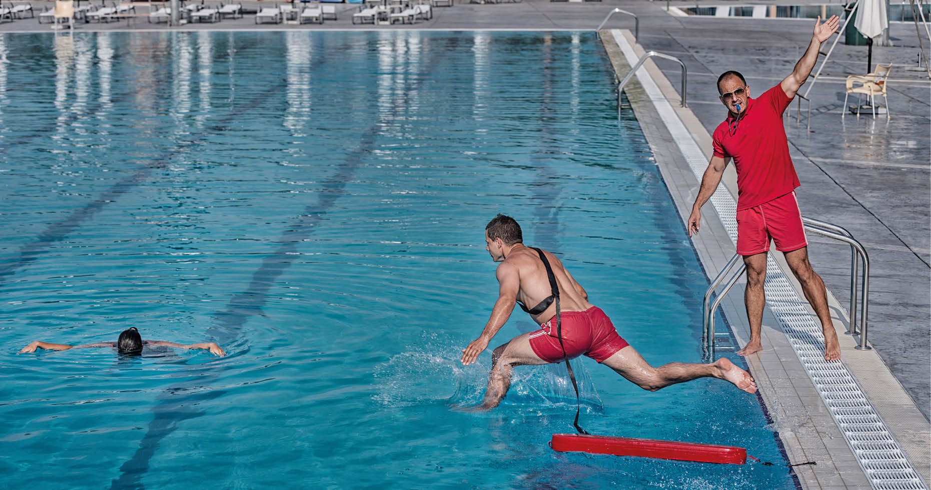 Lifeguard training course - rescuing victim from swimming pool